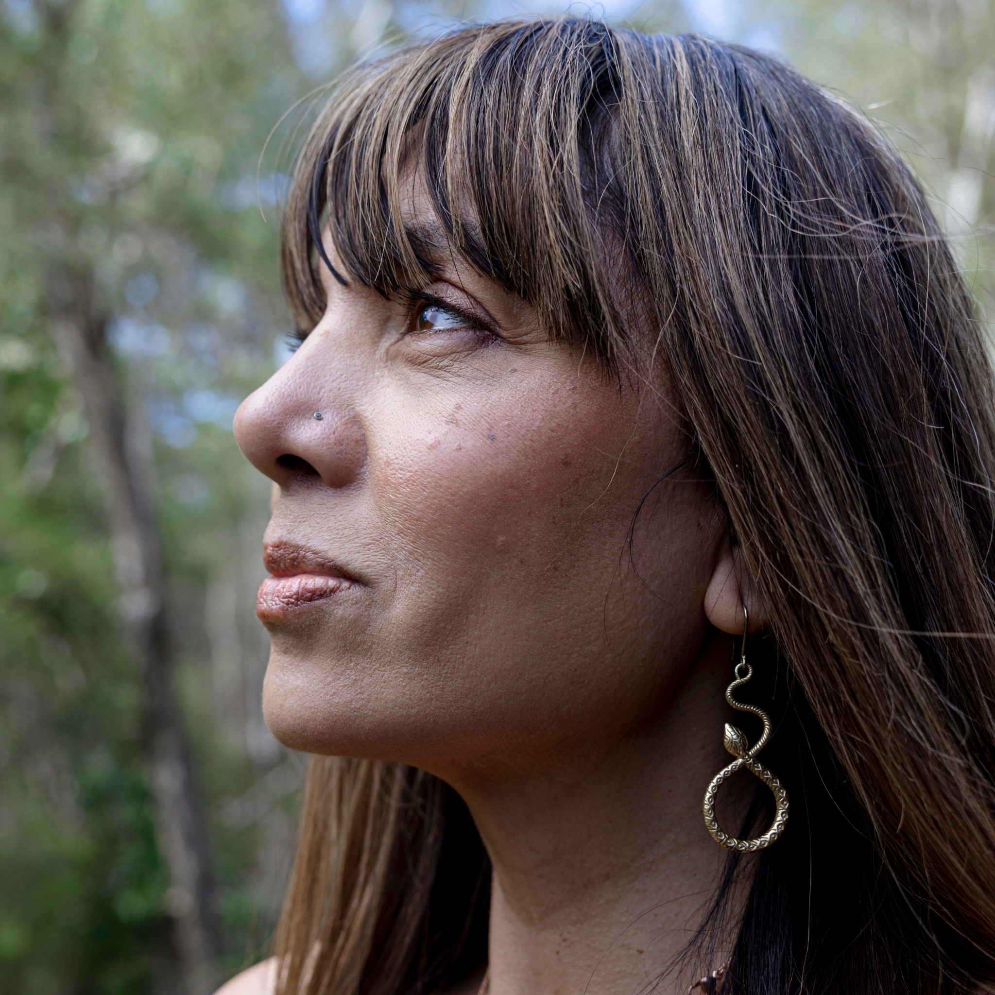 Model using bronze tinted cheek and lip creme