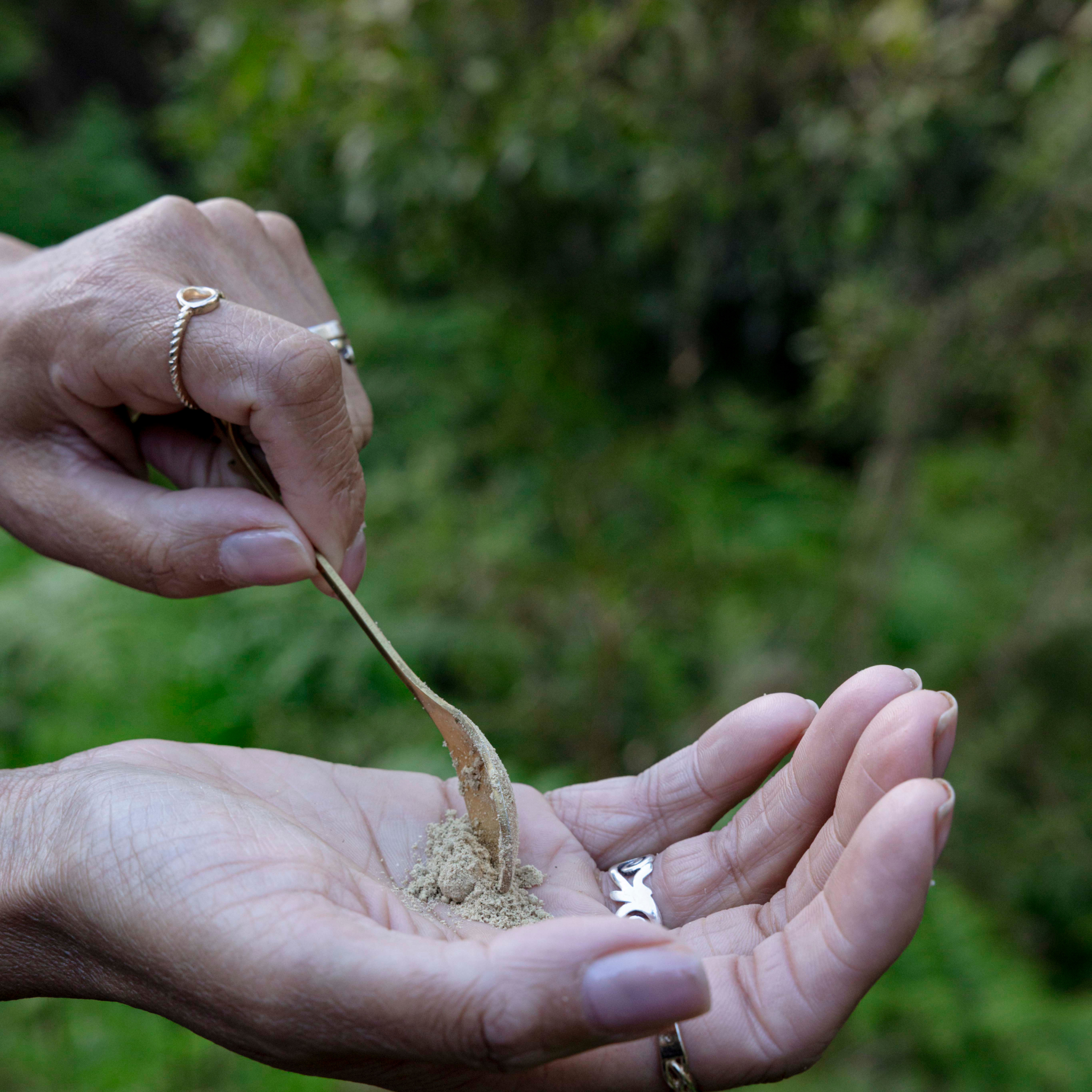 Putting renewal face polish into hand