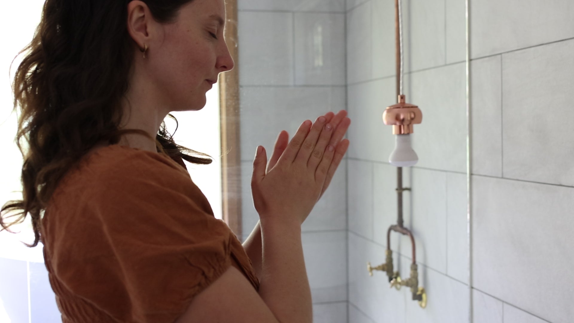 Applying Award Winning Lumiere Face Elixir 